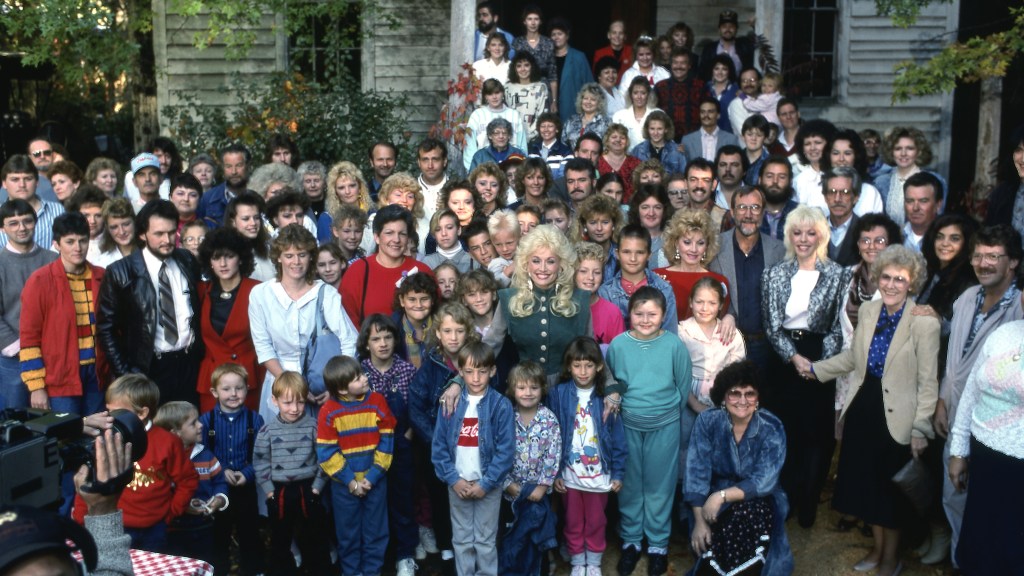 Group shot of Dolly Parton with family and crew on set of her 1987 TV special
