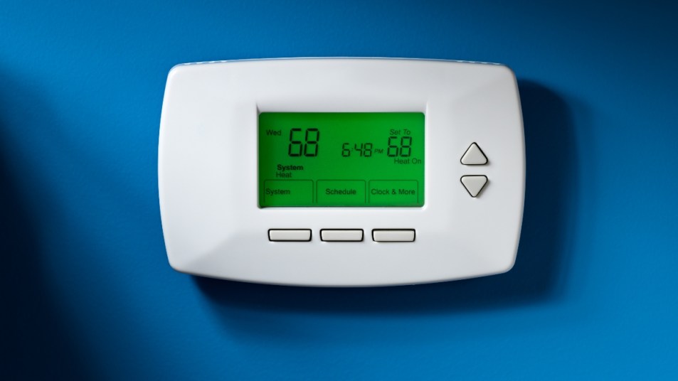 A programmable thermostat showing how to save money