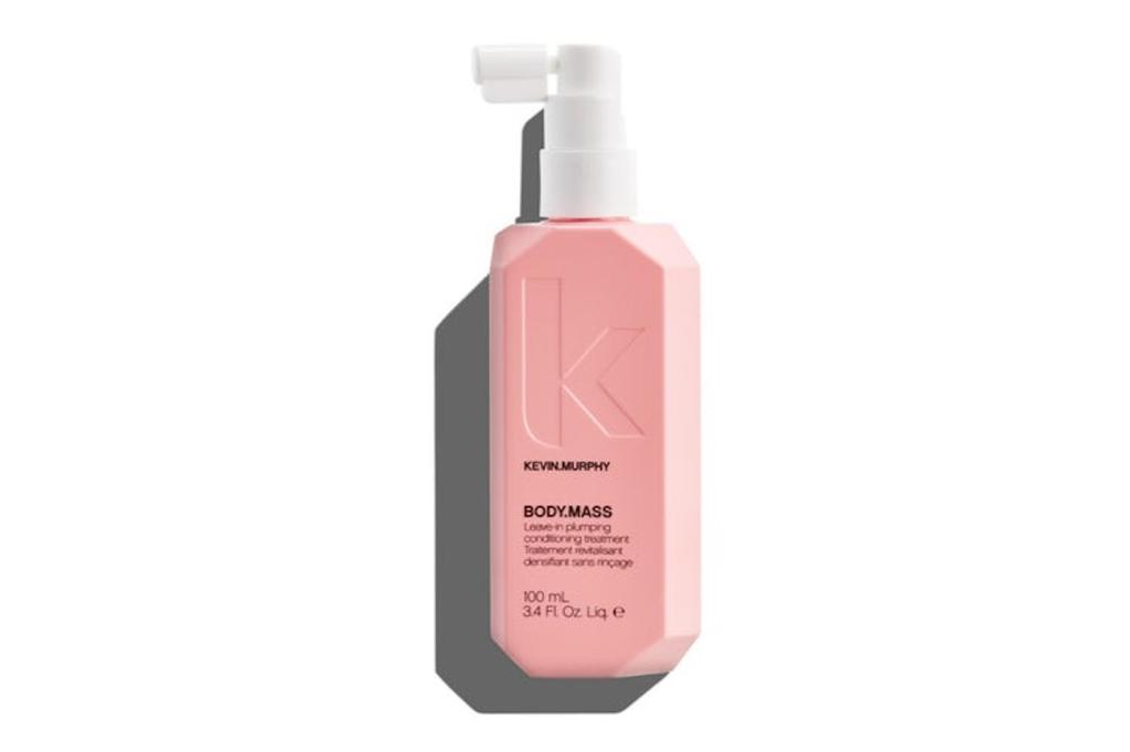pink bottle of hair thickening spray