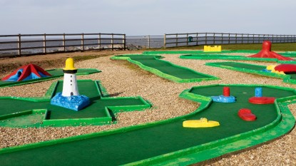 A mini golf course with obstacles