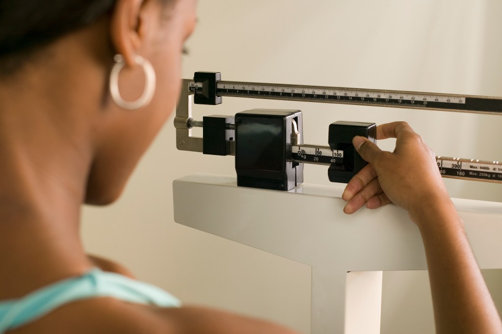 Woman checks weight