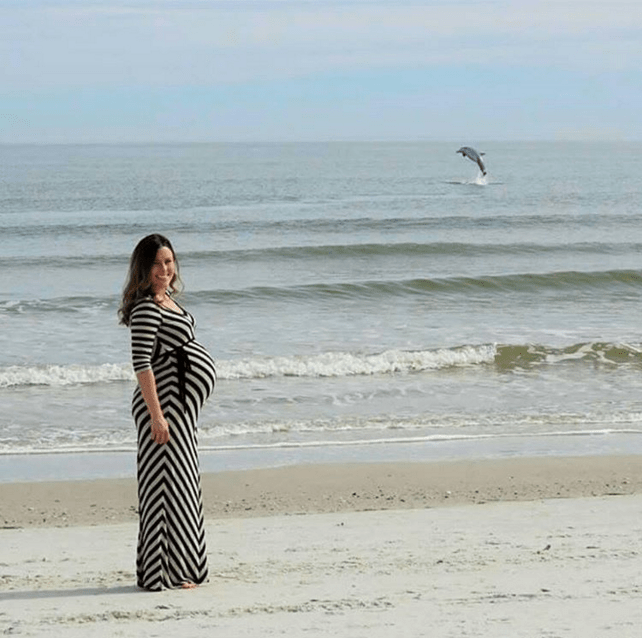 Maternity Photobombs Dolphin