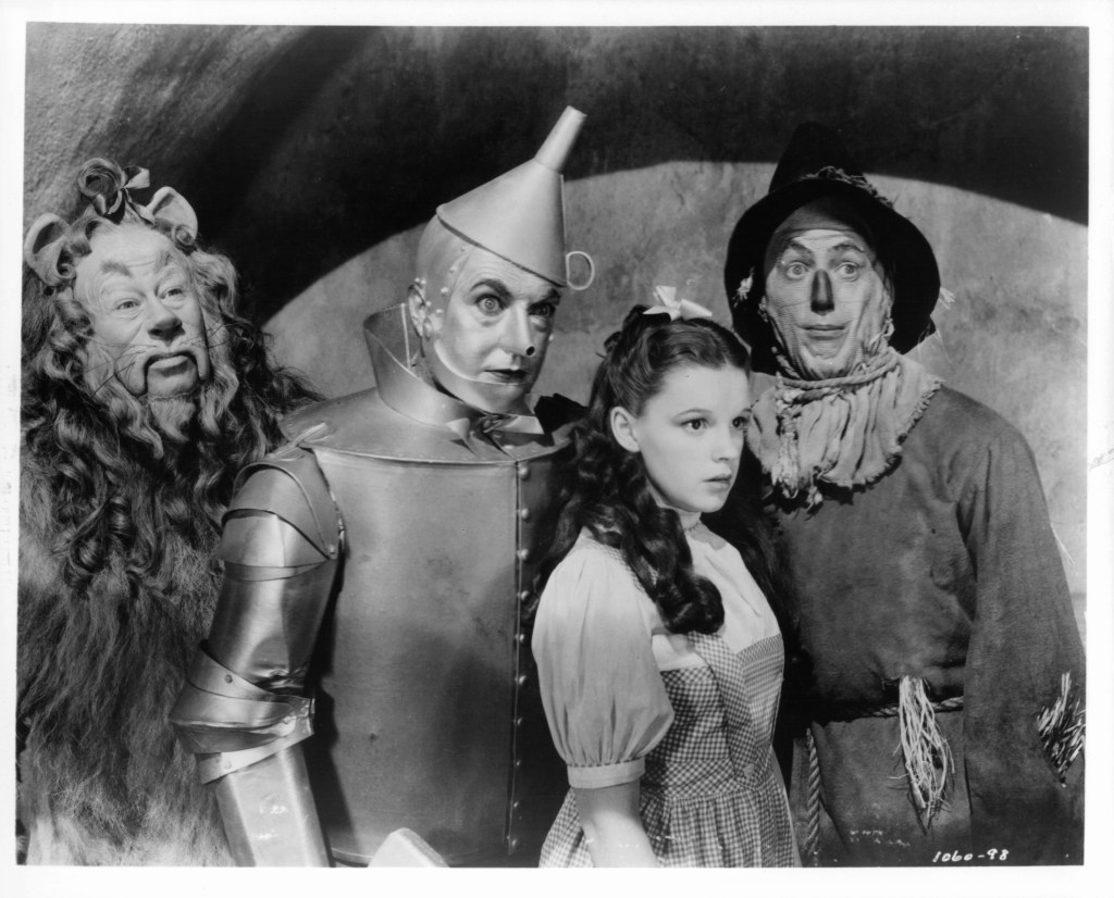 Bert Lahr as the Cowardly Lion, Jack Haley as the Tin Man, Judy Garland as Dorothy Gale and Ray Bolger as the Scarecrow in a scene from the film 'The Wizard Of Oz', 1939.(Wizard of Oz behind the scenes)
