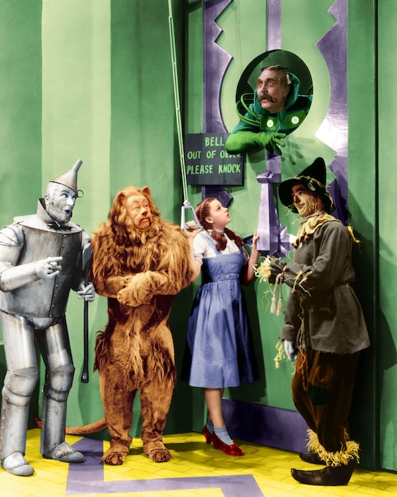 Jack Haley (1898 - 1979) as the Tin Man, Bert Lahr (1895 - 1967) as the Cowardly Lion, Judy Garland (1922 - 1969) as Dorothy, Ray Bolger (1904 - 1987) as the Scarecrow and Frank Morgan (1890 - 1949) as the Doorman to the Emerald City in 'The Wizard of Oz', 1939. (Wizard of Oz behind the scenes)