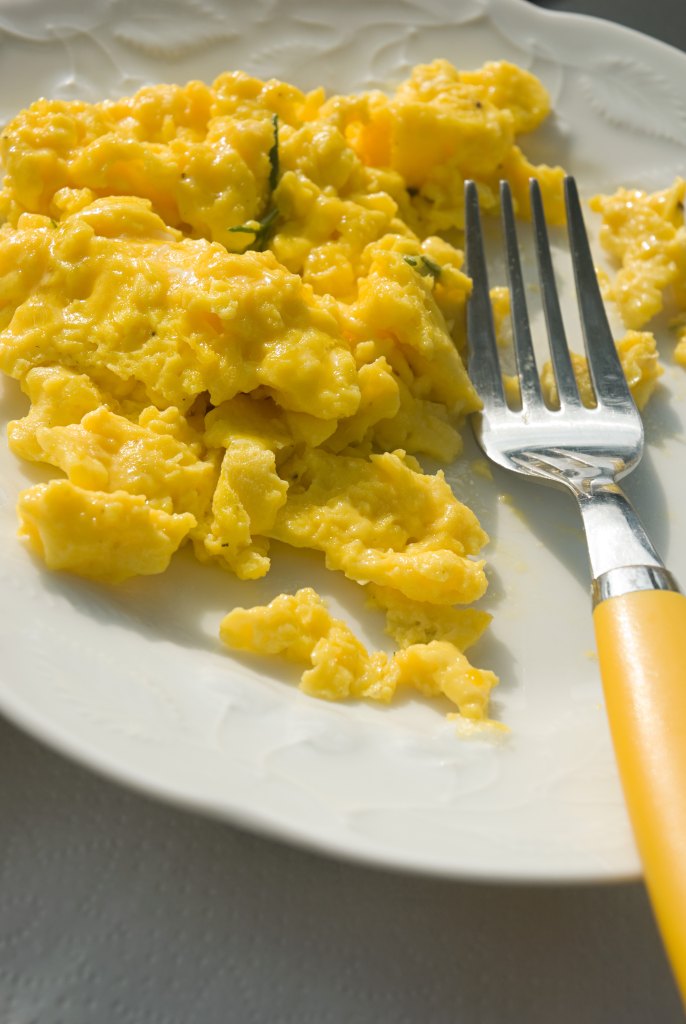Scrambled Eggs On White Plate