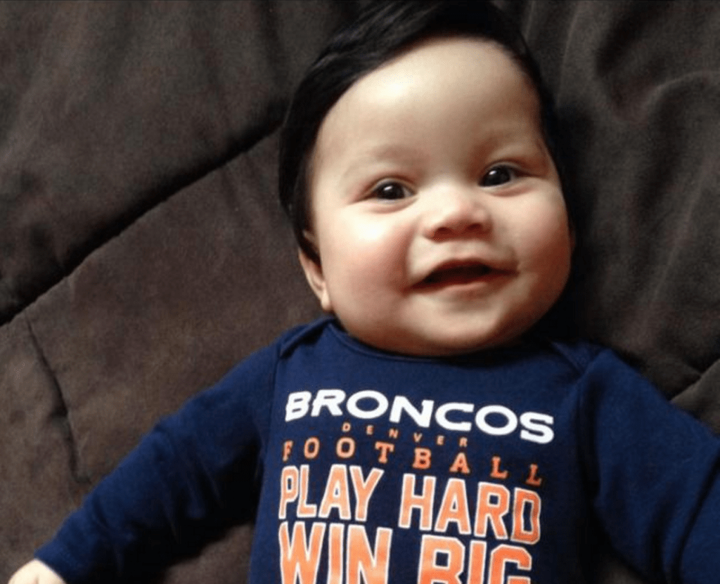 babies born with tons of hair smile