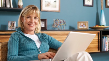 mature woman on her laptop working from home