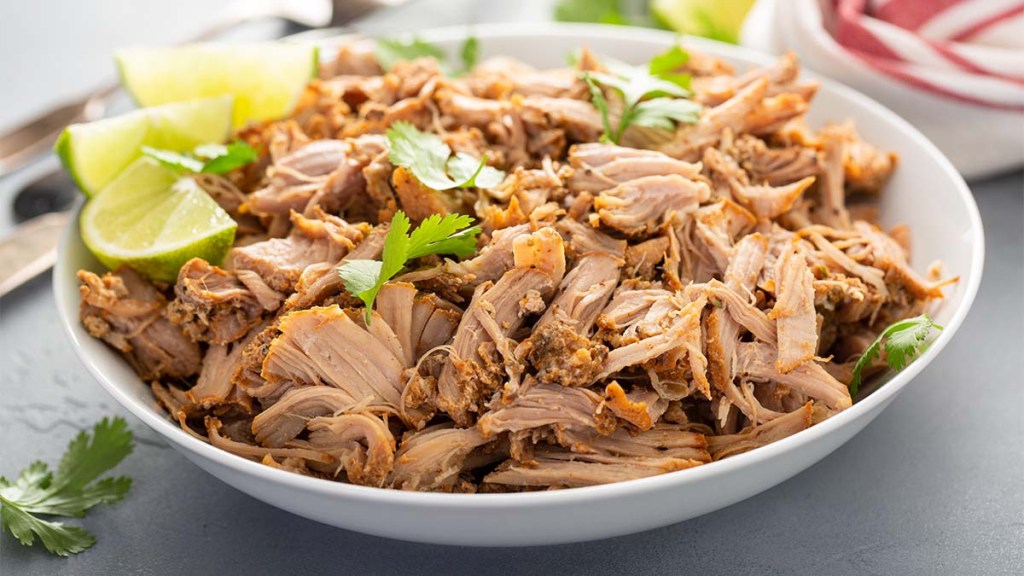Plate of shredded slow-cooked pork as part of a diet used by women who lost 150 lbs with no loose skin