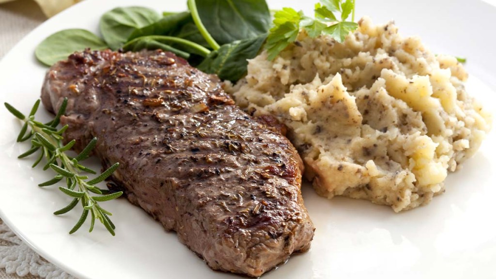 Grilled steak with mashed steamed cauliflower as part of a diet that helps people lose weight with no loose skin