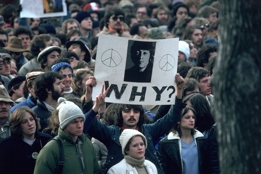 December 1980: Fans of John Lennon holding a vigil after he was shot dead by a fan on December 8th at his home in New York: Beatlemania in My Life