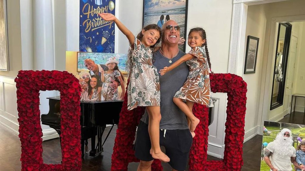 best celebrity dads: "The Rock" with Tiana, and Simone in 2022.
