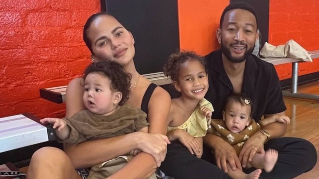 best celebrity dads: Chrissy Teigen and John Legend with three of their kids in 2023