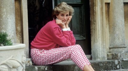 Princess Diana in pink outfit on a stoop