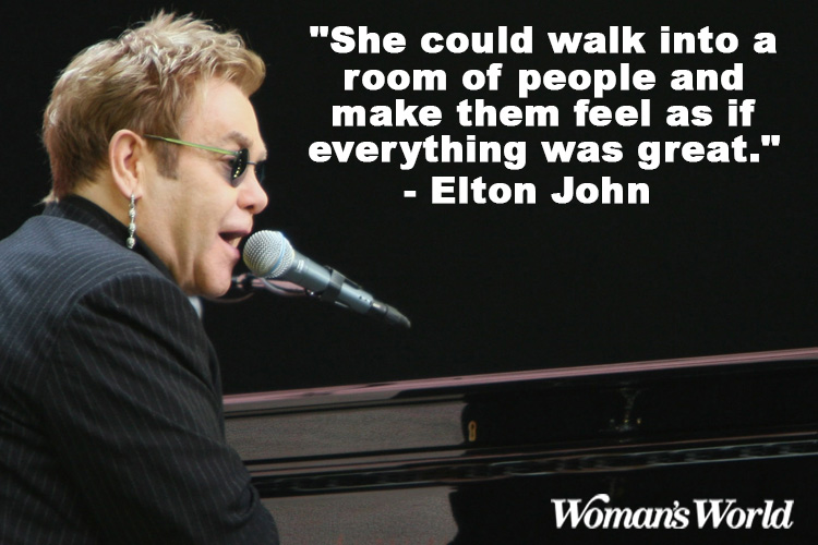 Elton John singing with a quote on his right