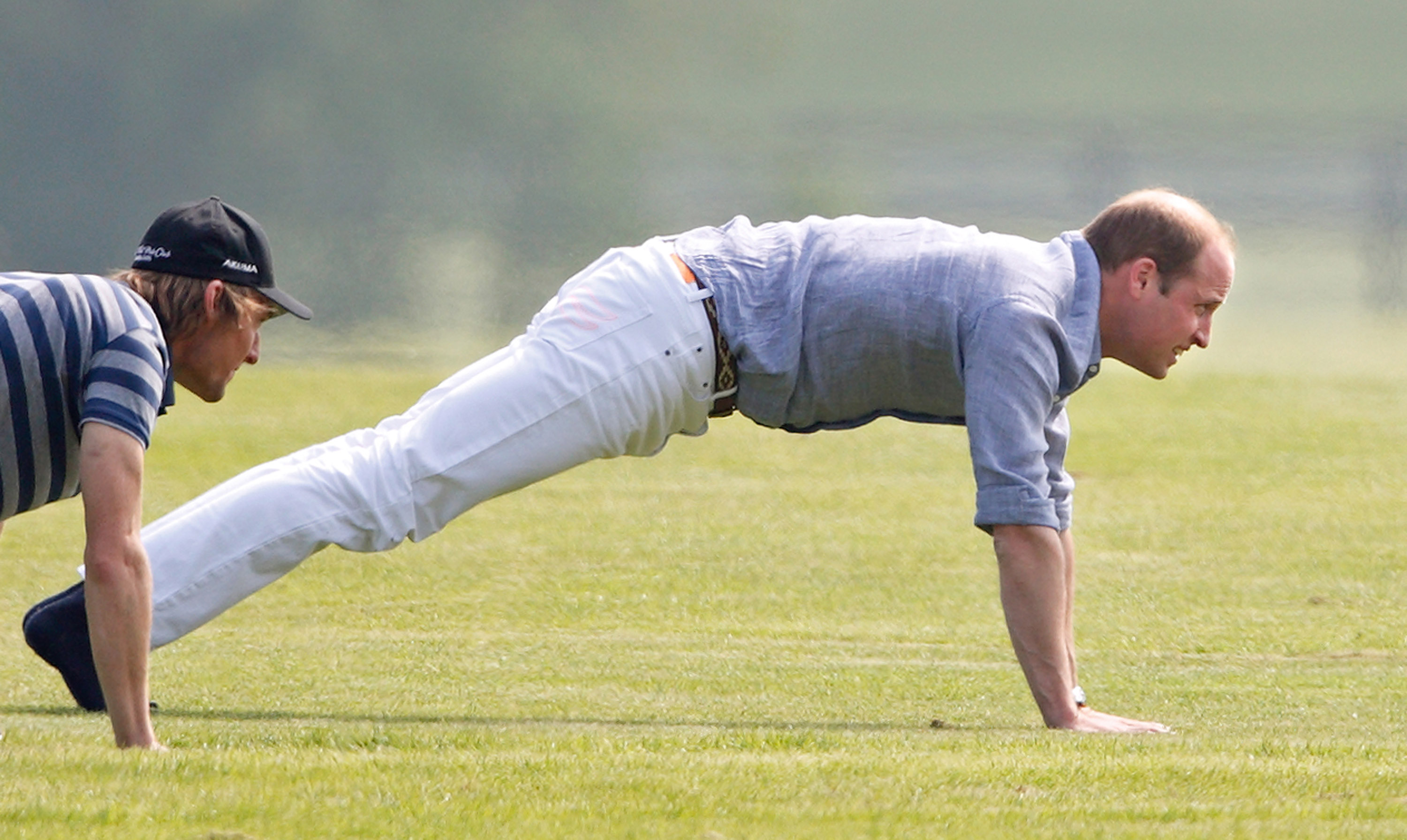 Prince William holding a plank pose before polo match.
