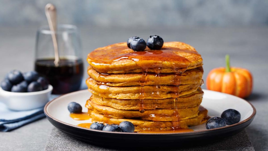 Stack of pumpkin pancakes on a plate made with a recipe that is zero points on Weight Watchers