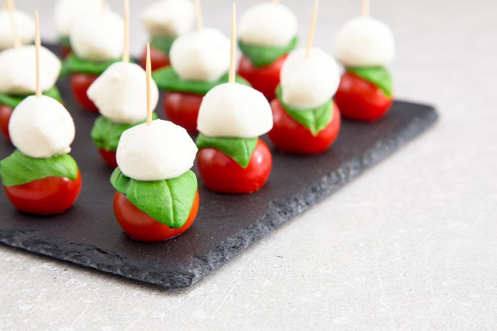 caprese bites on serving tray