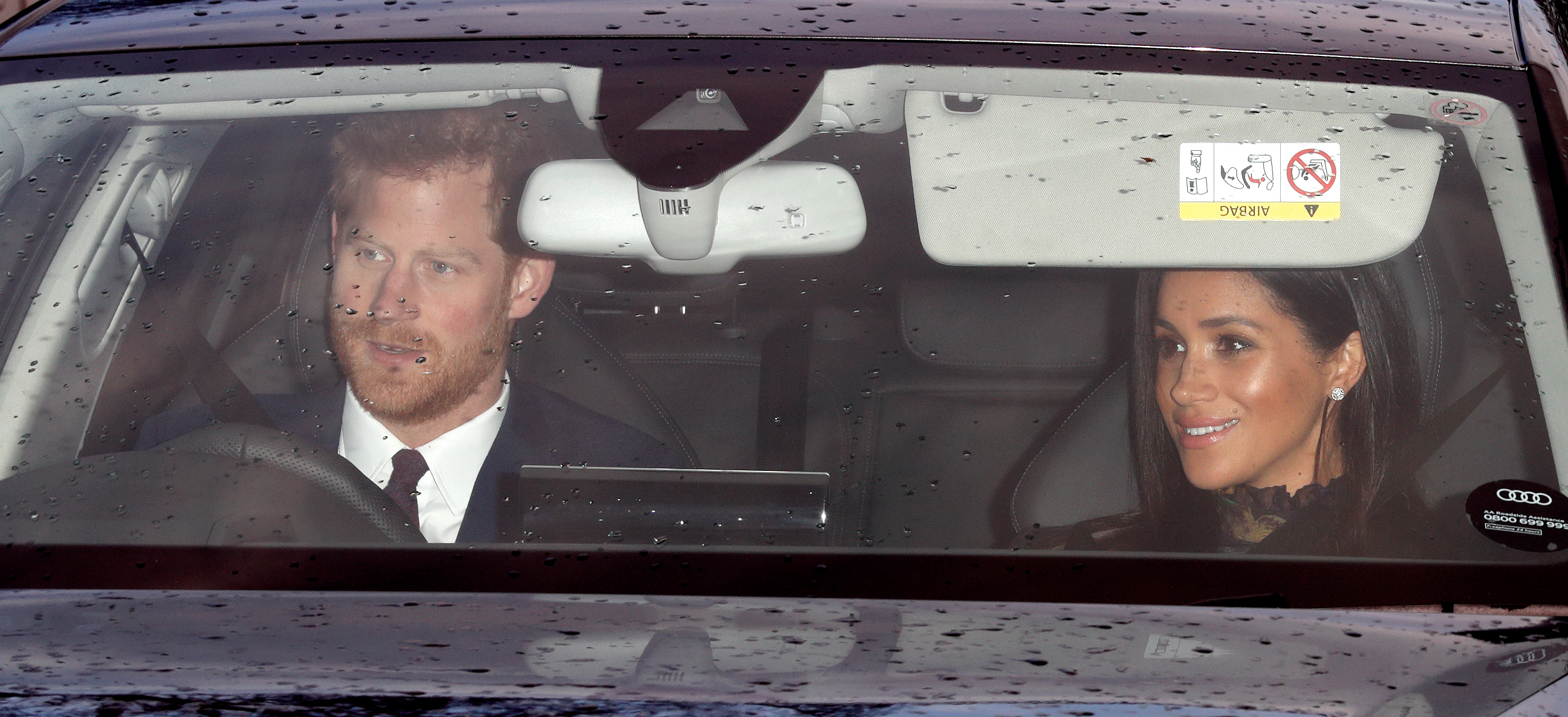 Prince Harry and Meghan Markle driving.