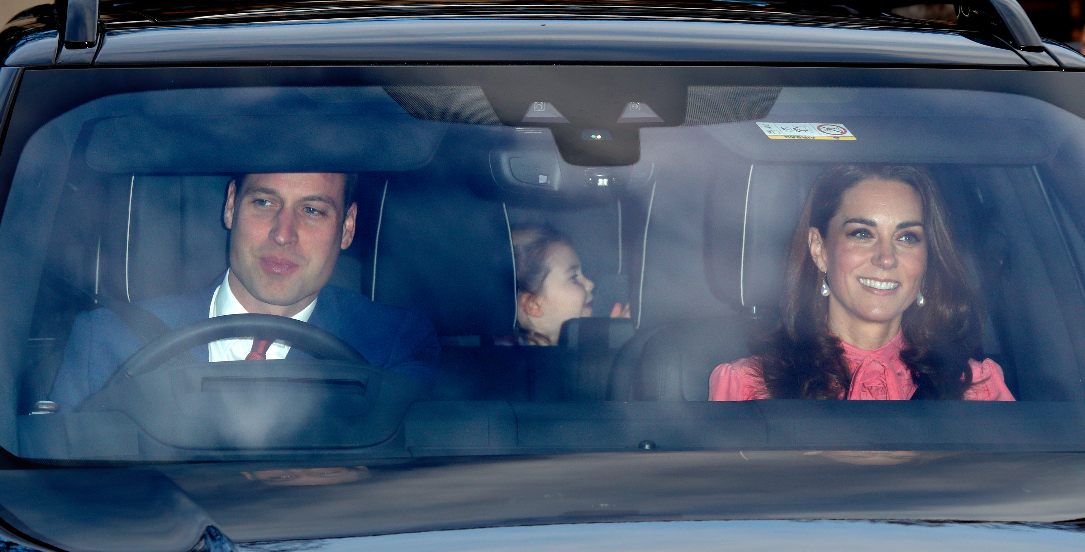 Prince William driving his family, Kate Middleton and Princess Charlotte.