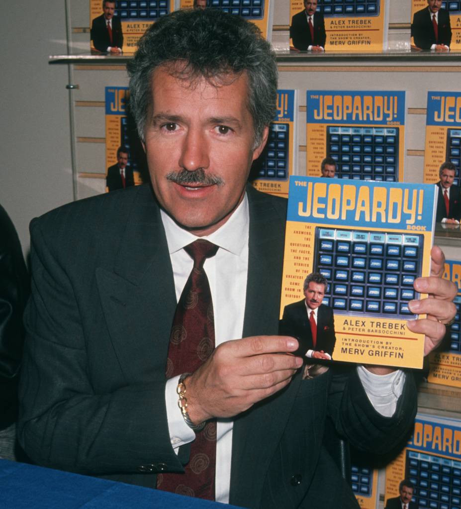 Alex Trebek with Jeopardy! book