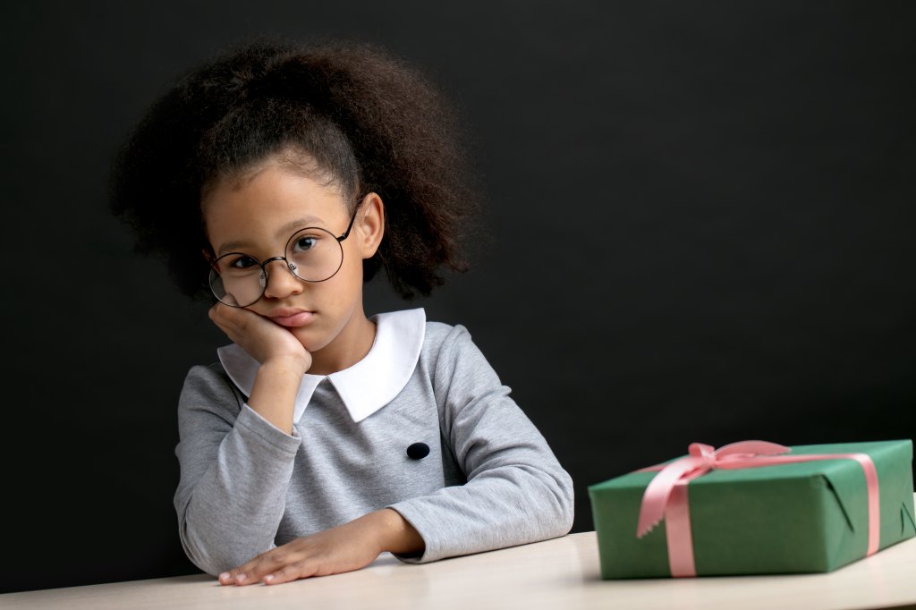 unhappy girl doesn't like her present