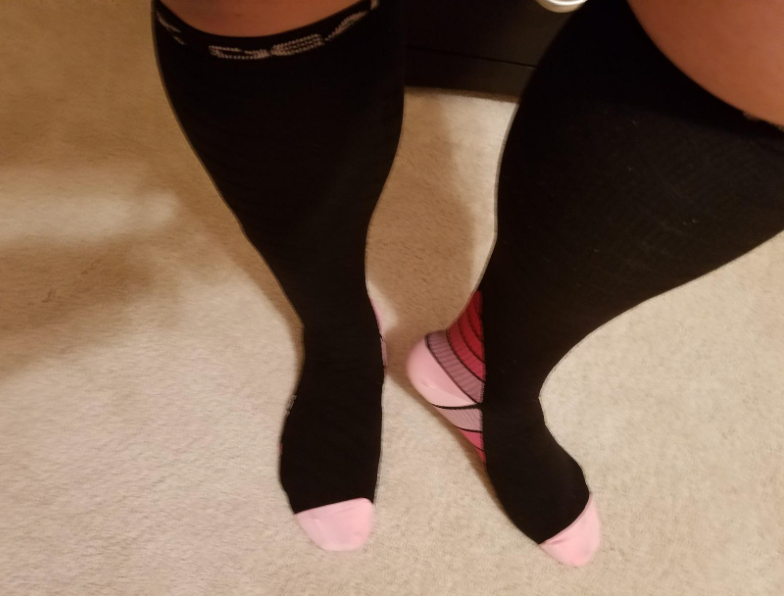 pregnant woman wearing compressions socks