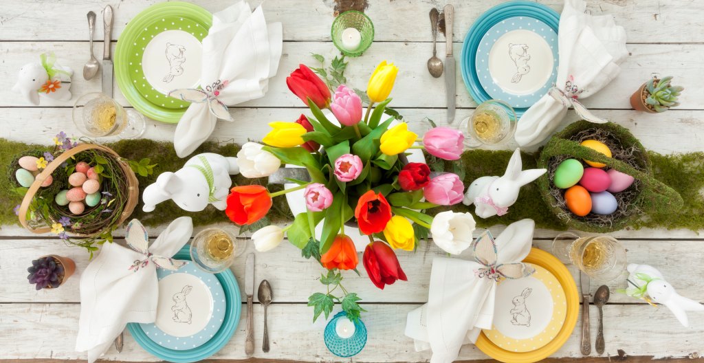 colorful easter table setting with bunny rabbit plates