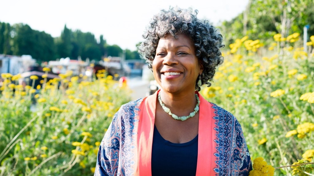 A woman walking out in nature to heal her adrenals