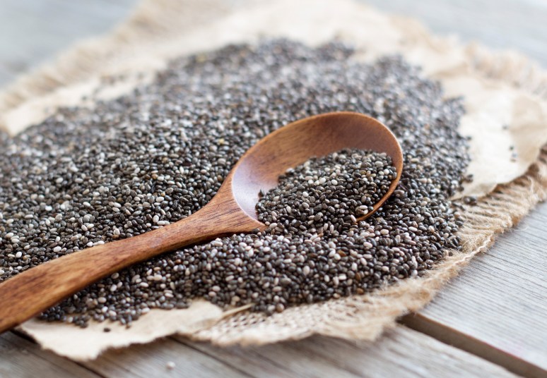 close up of chia seeds and a wooden spoon