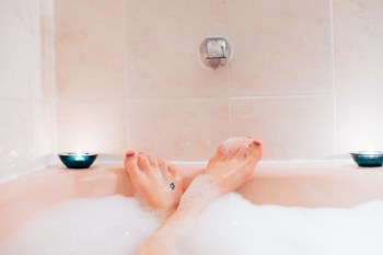 woman's feet sticking out from a bubble bath