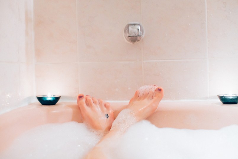 woman's feet sticking out from a bubble bath