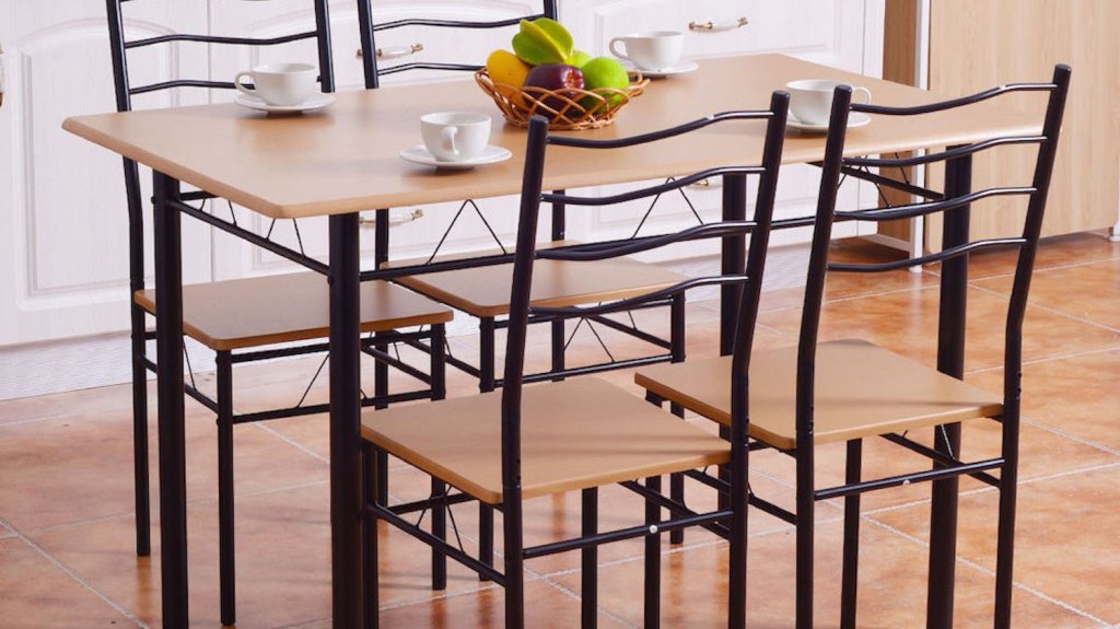 table and four chairs in a light kitchen setting