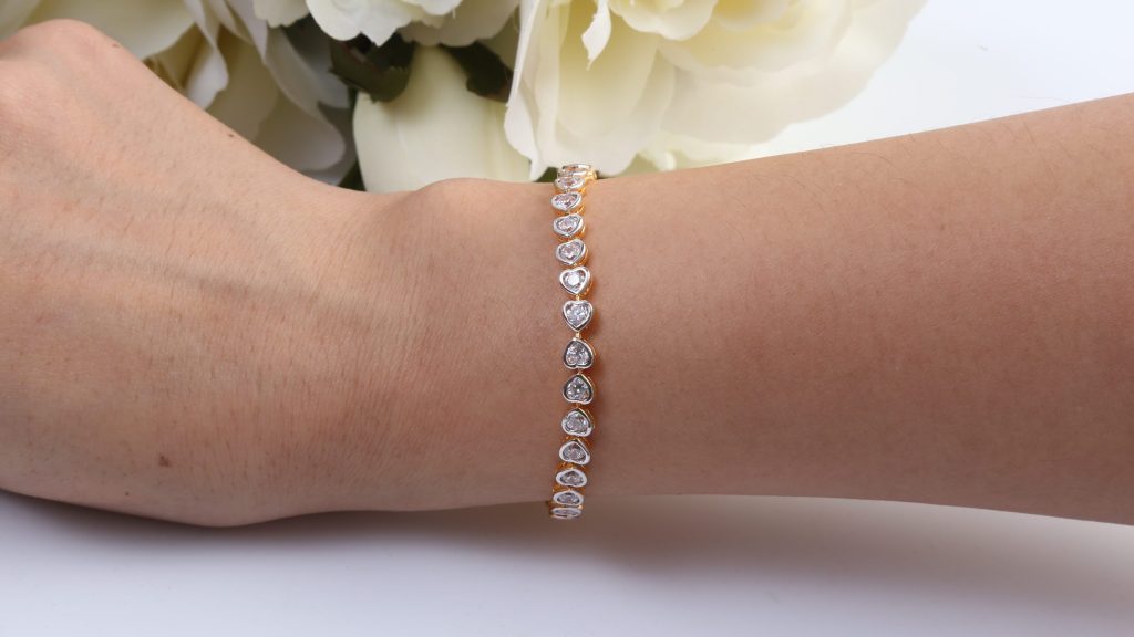 Gold and diamond heart shape bracelet.
