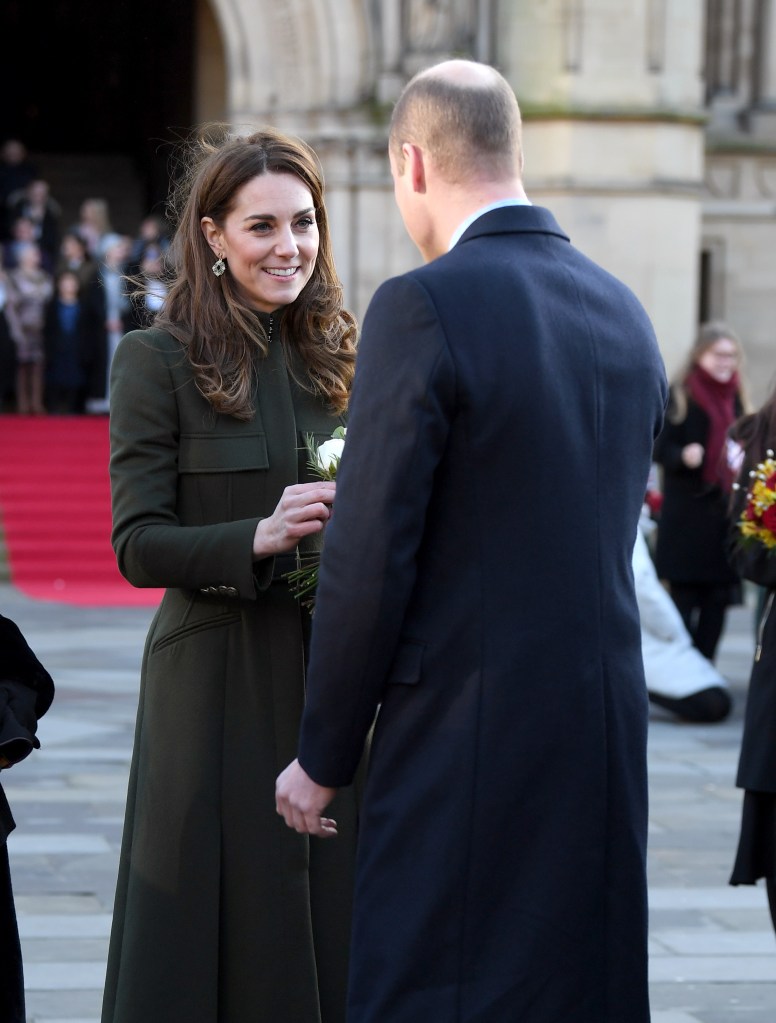 kate middleton receiving flowers from Prince William