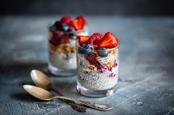 chia pudding in glass jar garnished with berries