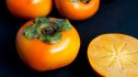 Persimmons with black background
