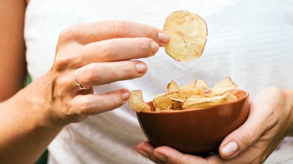 Woman holding potato chips