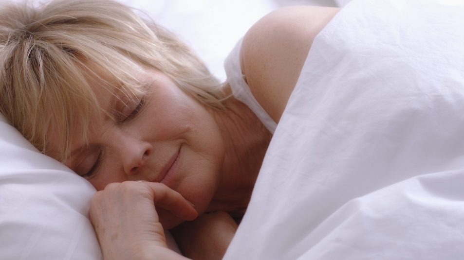 mature woman asleep in bed