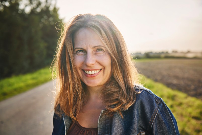 Portrait of smiling woman in the countryside