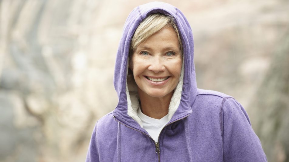 Mature woman in purple hoodie