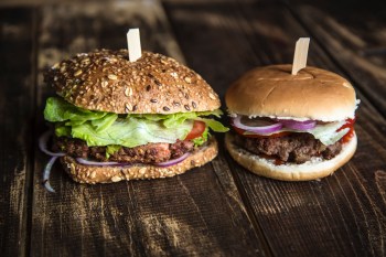 Vegetarian Burger next to hamburger