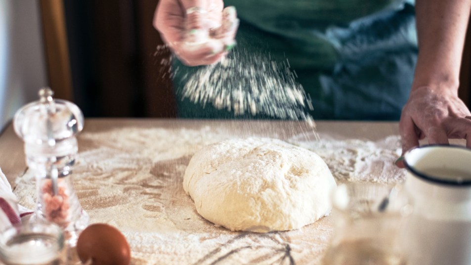 Woman making pizza dough