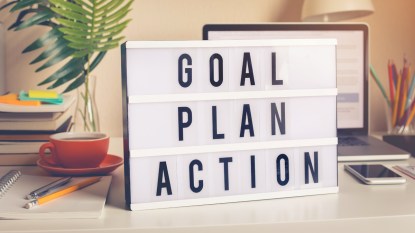 Sign reading "goal, plan, action"
