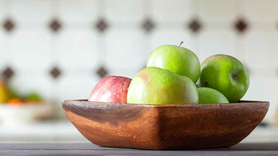Wooden bowl with red and green apples
