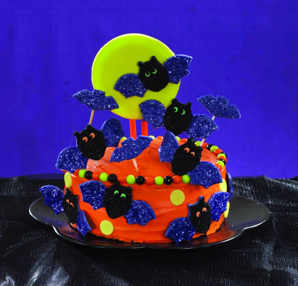 Orange cake with candy bats