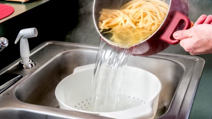 Draining pasta in sink