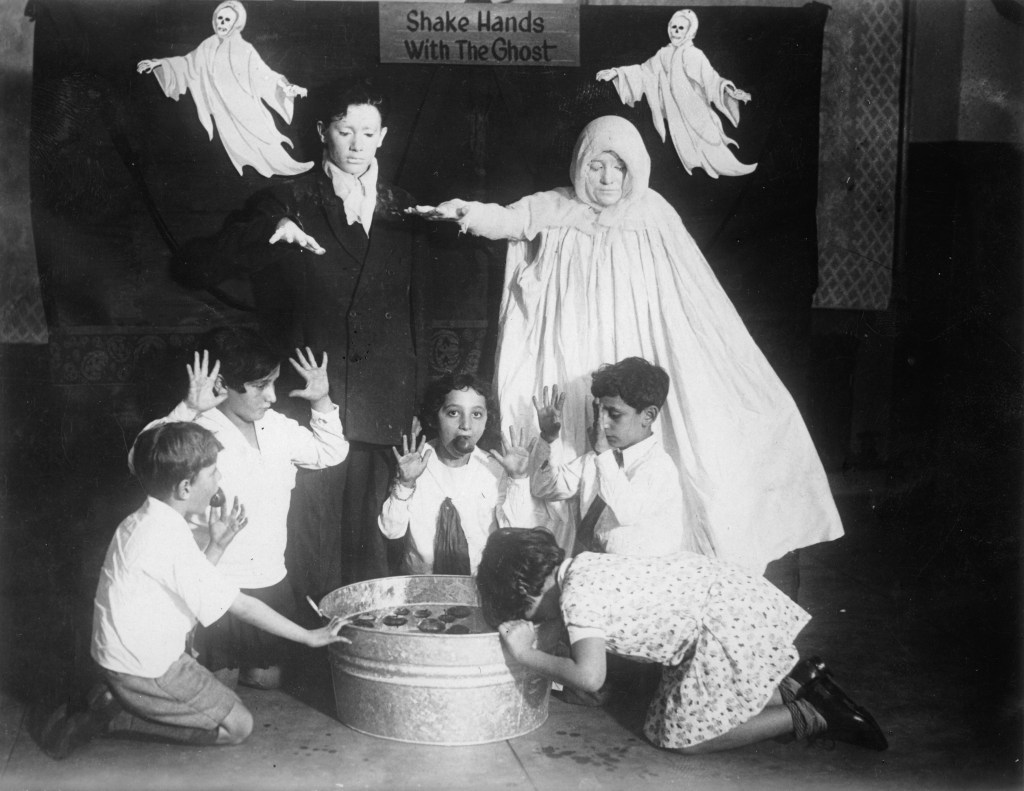 Kids bobbing for apples, 1935