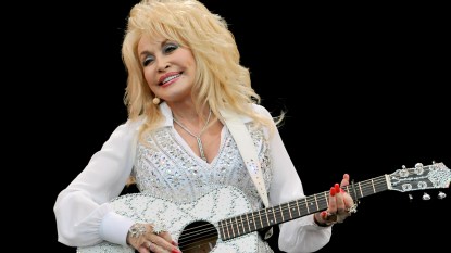 Dolly Parton playing guitar