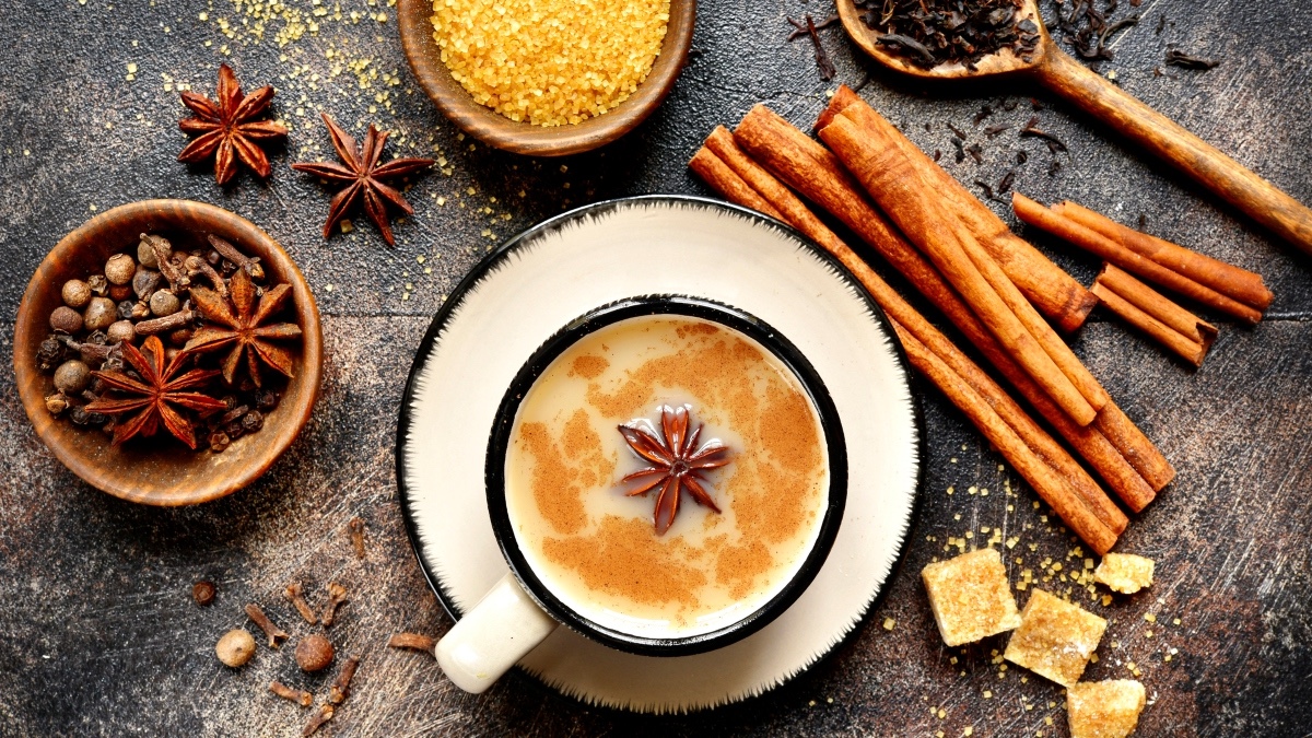A table full of fall spices such as cinnamon star anise