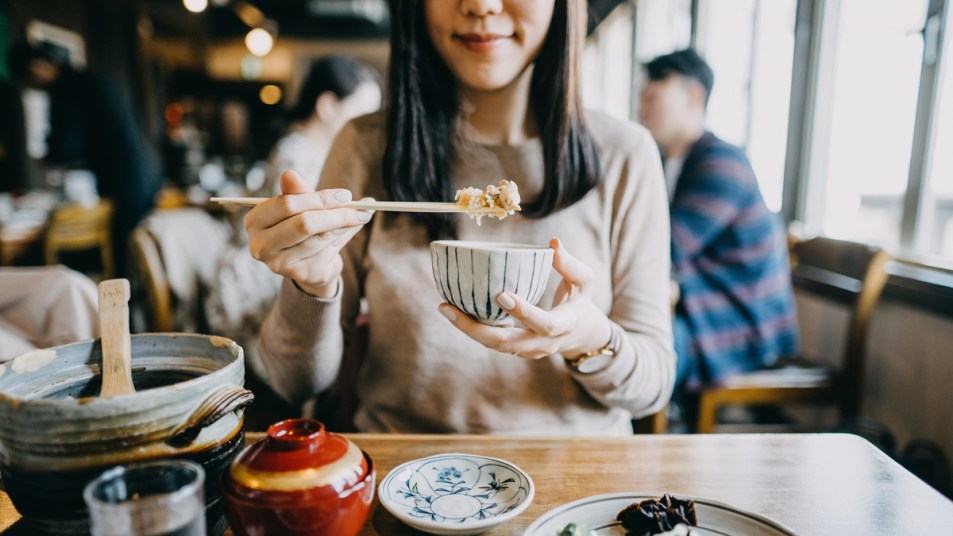 Woman eating Japanese food